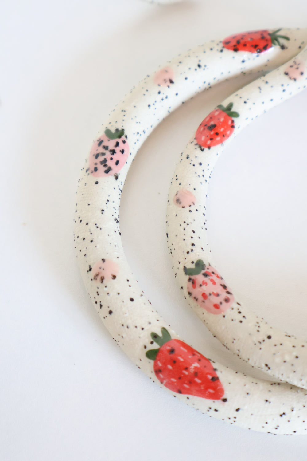 Close up of the pink and red strawberry decals